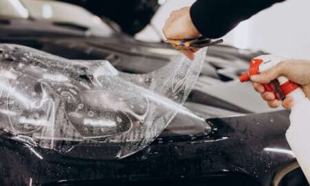 male-worker-wrapping-car-with-ptotective-foil